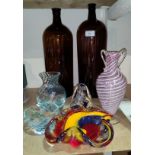 Two amber glass chemist style bottles, ht 40 and 37cm, other coloured glassware