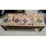 A Danish mid 20th century designer coffee table in dark hardwood with tiles by Tue Poulsen, frame b