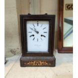 A 19th century French mantel clock in inlaid ebonised case, with white enamel dial and French drum