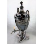 A silver plated tea urn in the embossed classical style