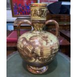 An 18th/19th century large Hispano-Moresque baluster vase, tin glazed with copper lustre stylized
