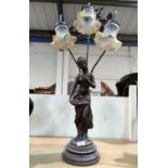 An Art Nouveau style table lamp with 3 branches in the form of a bronzed female figure