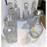 A selection of 6 cut glass decanters