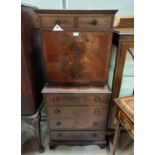A reproduction mahogany secretaire on chest, with fall front and fitted interior, 4 drawers below