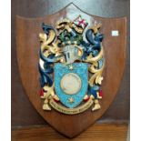 A coat of arms of Captain Cook on shield shaped wall plaque 'circa orbem' to the crest, 'Nil