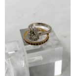 A white metal and diamond ring stamped '18ct' size 'J' (central stone missing); a yellow metal