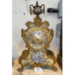 A Louis XV style mantel clock in brass and champlevé case with vase finial, ornate filigree dial and
