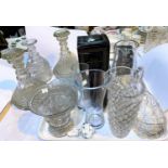 A heavy cut crystal pair of ships decanters with triple ringed necks; glassware