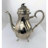 A Swedish white metal coffee pot of ribbed baluster form with flower finial and 4 feet, 20oz. /