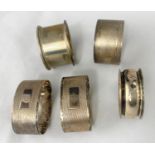 Five hallmarked silver napkin rings, various dates, 3.25 oz