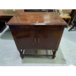 A 1930's blanket box; a folding chair; a mirror and a gramophone cabinet and a Lloyd Loom linen box