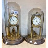 Two early 20th century brass 400 day clocks under brass domes