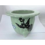 A Chinese celadon jardinière with scalloped rim decorated with a phoenix and clouds, height 15cm,