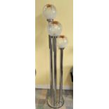 An Italian mid century chrome three height standard lamp in the manner of Mazzega with shaped