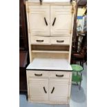 A vintage 1930's white and enamel kitchen cabinet with double doors above and below and 4 drawers,
