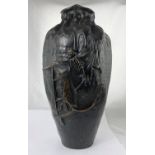 A large Japanese Meiji period bronze vase modeled to look like ceramic with heavy glaze dripping