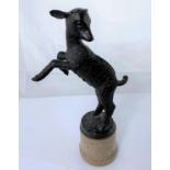 A bronze 'animalier' figure of a leaping lamb, on polished stone base, 29 cm overall