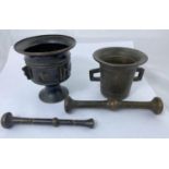 Two oriental pestle and mortars