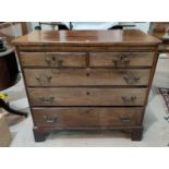 A Georgian mahogany bachelors chest of 3 long and 2 short drawers, with brushing slide and brass