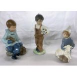 A Lladro young girl kneeling holding a lamb; 2 Nao boys, 1 with football, 1 with a rabbit