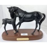 A Royal Doulton ceramic group Black Beauty and foal on wooden base