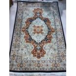 A modern hand knotted Persian rug with floral pattern on a fawn / pale green ground, length 190 cm,