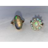 A 9 carat hallmarked gold dress ring set large oval opal coloured stone size 'O'; a 9 carat