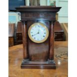 A 19th century French 4 pillar clock in mahogany case with white enamel circular dial and ormolu