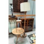 A stained wood standard lamp; a tile top plant stand; a pine occasional table with circular top