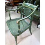 A Regency style armchair with cane back, the seat in green and gilt finish