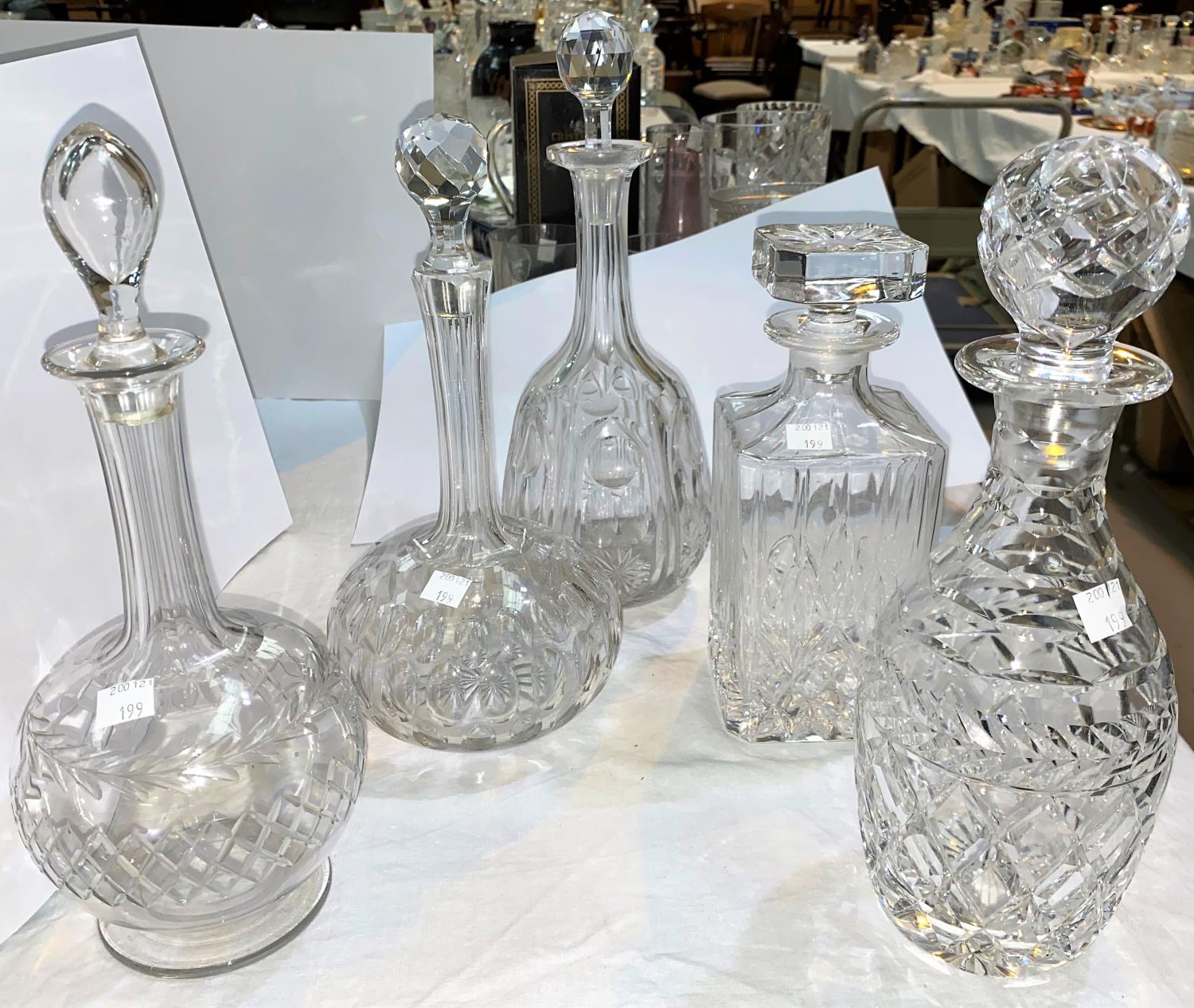 A selection of 6 cut glass decanters