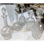 A selection of 6 cut glass decanters