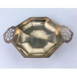 An octagonal Art Deco dish with pierced handles, Sheffield 1933, 4.5oz. / 135gm, length 18cm