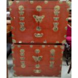 A pair of late 19th / early 20th century Chinese red lacquer cabinets with brass binding, with