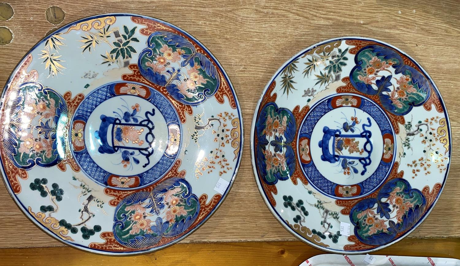 A pair of Japanese Imari plaques, diameter 31cm