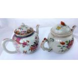 Two Chinese famille rose tea pots with floral decoration, both 21cm length, one handle pinned and