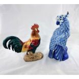 A Beswick "Longhorn" cockerel (a.f.); a blue & white parrot; etc.