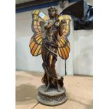 An Art Nouveau style table lamp in the form of a bronze fairy with coloured and leaded butterfly