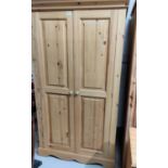 A modern pine part fitted 2 door wardrobe