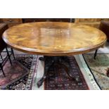 A Victorian inlaid walnut looe table with oval top, on turned carved column and 4 splay feet