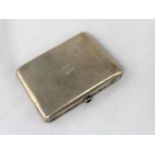 A Russian white metal cigarette case stamped '875' with a head mark to interior, red cabochon