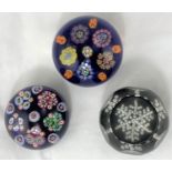 A "Snow Crystal" limited edition paperweight by Whitefriar's; a pair of millefiori paperweights