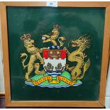 A coat of arms 'Hong Kong' 37 x 35cm, on enamel background, framed