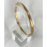 A 9 carat hallmarked gold hinged bangle, 6.5 gm