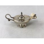 A silver neo classical style table cigar lighter, entwined snake handle, Birmingham 1895, 3.25oz