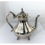 A Swedish white metal coffee pot of lobed baluster form with bud finial and 4 scroll feet,