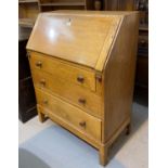A mid 20th century oak bureau with fall font and 3 drawers, width 76 cm