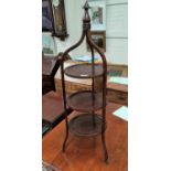 An Edwardian mahogany 3 tier cake stand, stringing decoration