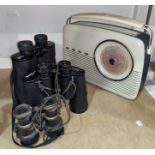 Three sets of binoculars and a vintage Bush radio