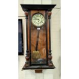 A 19th century Vienna wall clock in walnut case with ebonised mouldings, white enamel circular